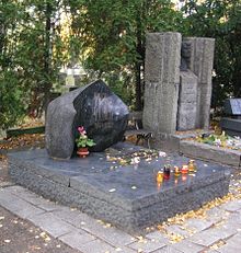 Graves of Julian Tuwim (left) and Zofia Nałkowska (right) adorned with dark bronze bust, in Powązki Cemetery, Warsaw