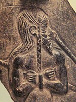 Prisoner of the Akkadian Empire, nude, fettered, drawn by nose ring, with pointed beard and vertical braid. Thought to depict a typical Marhashi.[39] 2350-2000 BC, Louvre Museum AO 5683.[40]