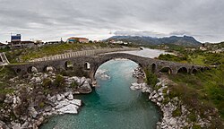 The village of Mes with the Mes bridge in the background