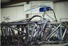 A Shelby Can Am tube frame chassis on the surface plate at Racefab Inc. Racefab Inc. Shelby Can Am Chassis.jpg