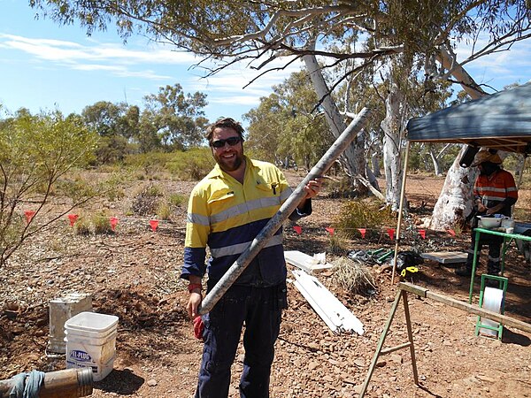 An engineering geologist logging rock core in the field, Western Australia.