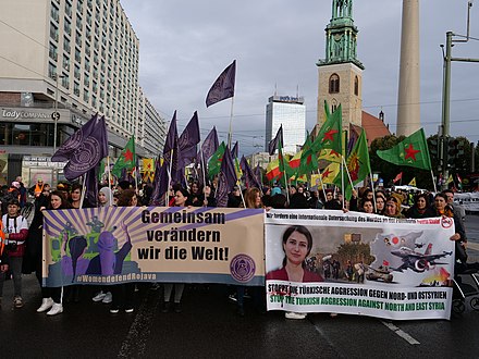 Protest in Berlin, showing image of murdered Syrian-Kurdish politician Hevrin Khalaf