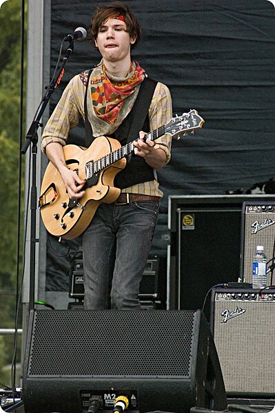 Former guitarist and vocalist Ryan Ross performing with the band in 2007. Ross was responsible for writing most of the music and lyrics until his depa