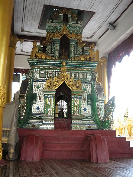 a well in Shwedagon Pagoda is embellished with glass mosaic.