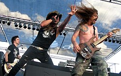 Skid Row today. L-R: Rachel Bolan, Johnny Solinger, and Scotti Hill Performing at the South Texas Rockfest in 2008.