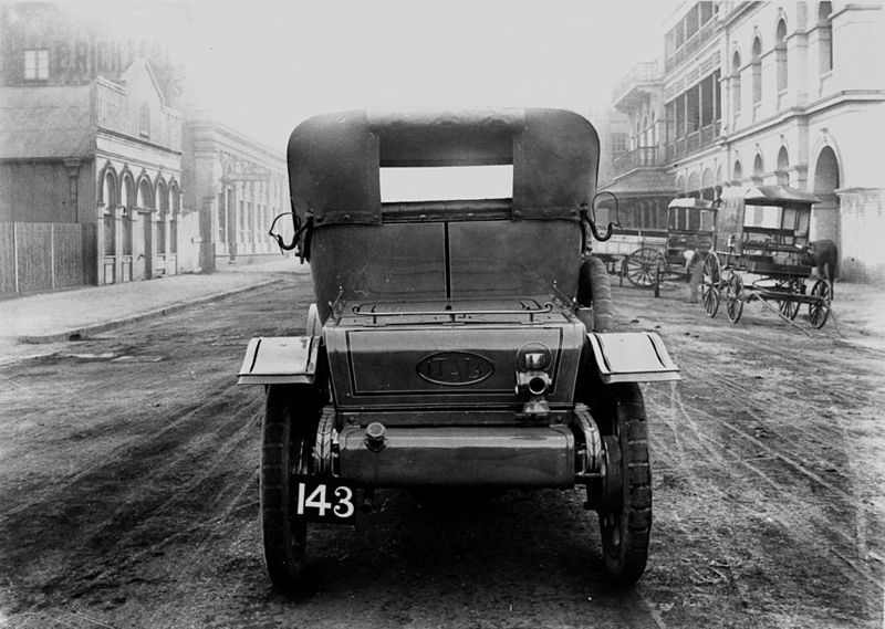 File:StateLibQld 1 139102 1912 Itala car next to horsedrawn vehicles in Brisbane street.jpg