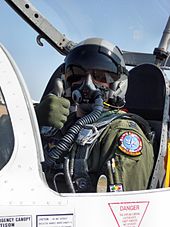 A T-37 pilot wearing a mask designed for both diluter- and pressure-demand breathing T-37 solo student pilot.jpg