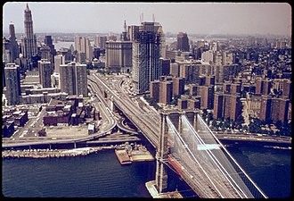 The building under construction in 1974 THE BROOKLYN BRIDGE INTO MANHATTAN, NEW YORK TRANSPORTATION IN AN URBAN AND INDUSTRIAL AREA LIKE NEW YORK PRODUCES... - NARA - 555733 color balance.jpg