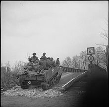 A Universal Carrier of the 6th Battalion, Cameronians (Scottish Rifles) crossing the Dortmund-Ems Canal, Germany, 4 April 1945. The British Army in North-west Europe 1944-45 BU3140.jpg