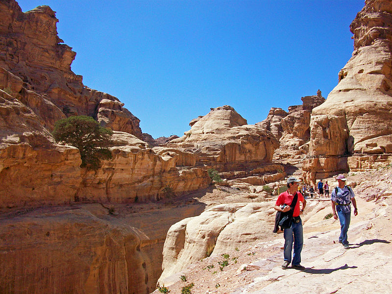 File:Tourists walking canyon edge near Ad-Dair, Petra.jpg