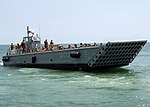 US Navy 090615-N-6676S-456 Landing Craft Mechanized (LCM) 14, assigned to Assault Craft Unit (ACU) 2, transports Sailors, Soldiers and Marines during operations supporting Joint Logistics Over-The-Shore (JLOTS) exercises.jpg
