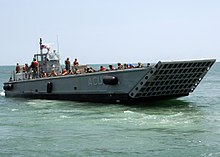An American landing craft mechanized (LCM) in June 2009 US Navy 090615-N-6676S-456 Landing Craft Mechanized (LCM) 14, assigned to Assault Craft Unit (ACU) 2, transports Sailors, Soldiers and Marines during operations supporting Joint Logistics Over-The-Shore (JLOTS) exercises.jpg