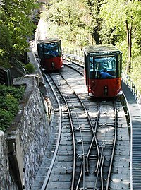 Both cars passing each other within the passing loop viewed down from the walking bride passing above the track