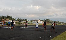 Young Tuvaluans playing rugby on the Funafuti airstrip Young Tuvaluans playing rugby on the Funafuti airstrip.jpg