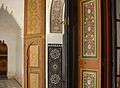 A variety of vernacular decorative Islamic styles in Morocco: girih-like wooden panels, zellige tilework, stucco calligraphy, and floral door panels