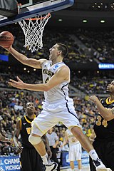 File:20131203 Mitch McGary against Quinn Cook and Josh Hairston.jpg -  Wikipedia