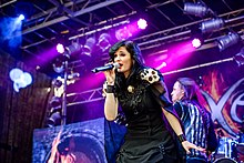 Van Giersbergen performing with Xandria in 2016 20160701 Mulheim CastleRock Xandria 0359.jpg