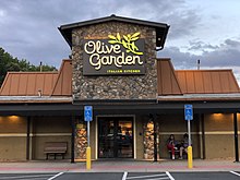 Olive Garden restaurant in Fair Lakes, Virginia 2021-08-18 19 54 47 The exterior front entrance of the Olive Garden in the Fair Lakes Shopping Center in Fair Lakes, Fairfax County, Virginia during the evening.jpg