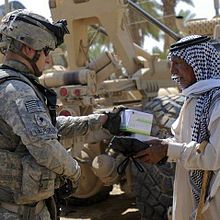 A 2-14 Soldier providing medical supplies to Iraqi citizen, during Operation "Outreach," a humanitarian aid mission near Baghdad, Iraq, 2010 214Soldier.jpg