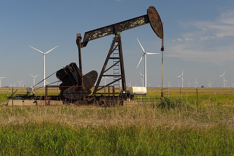 File:A now common scene in West Texas, wind turbines and pump jacks. (24745929749).jpg