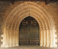 Buff-coloured basalt and limestone doorway to the CNI Afghan Church.[176]