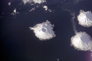 Herbert Island in the middle of the picture, Carlisle Island at the top right, the active volcano Mount Cleveland on Chuginadak at the bottom right.