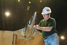 Tim Wright examines an F-35 Lightning II Joint Strike Fighter model in the AEDC's 16-foot transonic wind tunnel, December 15, 2006. Arnoldafb-3.jpg