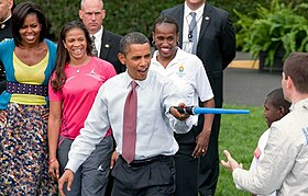 President Barack Obama participates in a fencing demonstration with Tim Morehouse on the White House lawn. Barack Obama and Tim Morehouse 2.jpg