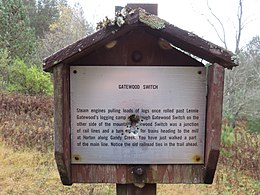 A sign along Big Run Trail (Forest Trail 527). Gatewood Switch – Steam engines pulling loads of logs once rolled past Lennie Gatewood's logging camp [and] through Gatewood Switch on the other side of the mountain. Gatewood Switch was a junction of rail lines and a turn around for trains heading to the mill at Horton along Gandy Creek. You have just walked a part of the main line. Notice the old railroad ties in the trail ahead. Monongahela National Forest, West Virginia, 8 October 2017