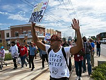 A 2015 protest in St. Paul by Black Lives Matter supporters against police brutality Black Lives Matter protest against St. Paul police brutality (21552673186).jpg