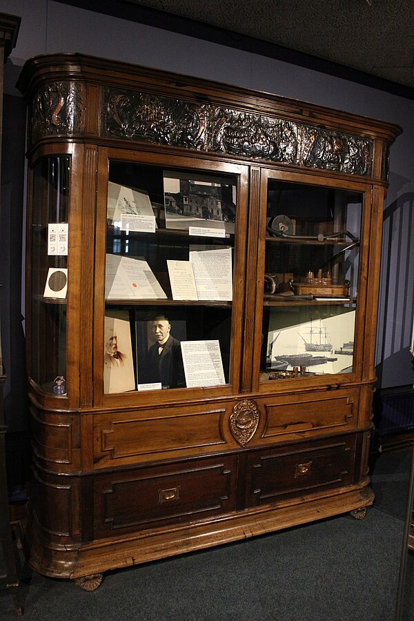 Cabinet at Monmouth Museum made of the wreckage of the Foudroyant and containing objects also made from the ship.