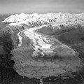 Capps Glacier, terminus of valley glacier partially covered in rocks and other debris, and winding folia, September 4, 1966 (GLACIERS 6443).jpg