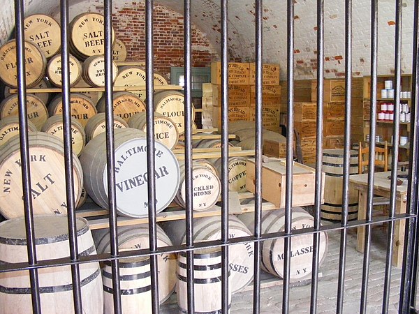 Barrels of salt beef and other products in a reconstruction of an American Civil War stockpile, at Fort Macon State Park, North Carolina