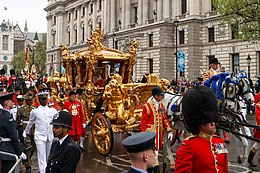 King Charles III and Queen Camilla riding in the coach on Coronation day, 2023. Coronation of Charles III and Camilla - Coronation Procession (01).jpg
