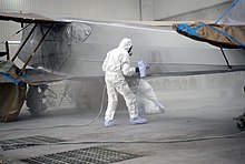Aircraft spray painting Dragon Rapide (5489614982).jpg