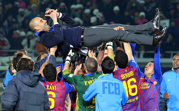 Pep Guardiola is hoisted in the air after Barcelona won the 2011 FIFA Club World Cup, beating Santos 4–0 in the final.