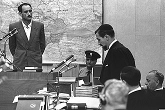 Photograph of a person giving testimony at a trial