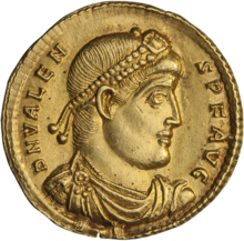 Golden coin depicting man with diadem facing right