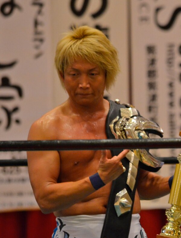 Ikuto Hidaka with the title belt