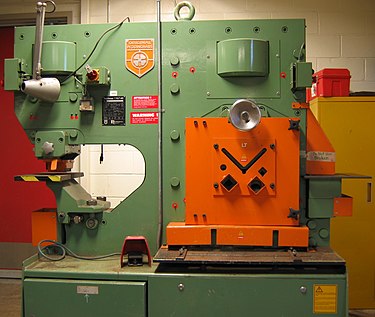 This particular machine stands over 6 ft (1.8 m) tall and can shear, notch, and punch precision holes in plate steel up to 5/8 in (15 mm) thick. Ironworker.triddle.jpg