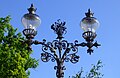 Lamps by the Adam Mickiewicz Monument in Warsaw.