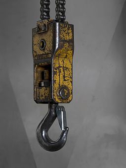 A lifting hook with a safety latch. Lifting hook with a safety latch hanging from a bridge crane.jpg