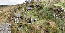 The remains of a Dartmoor blowing house, showing the furnace and mouldstone Lower blowing house, River Walkham, looking N.jpg