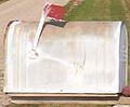 An oversize rural Joroleman mailbox in southern Nebraska, featuring a red semaphore arm