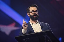 Walsh speaking at the 2022 AmericaFest in Phoenix, Arizona Matt Walsh (52585926772).jpg