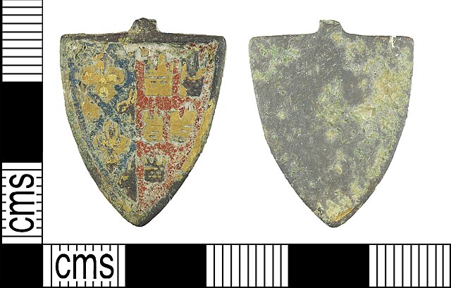 Arms of Alphonse on a 13th-century harness pendant, found in West Berkshire, England.