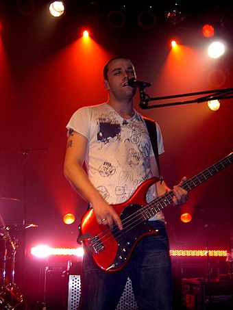 Chris Wolstenholme of Muse performing at the Mod Club Theatre, Toronto in 2004. The international Absolution tour included the band's first shows in North America since 1999.