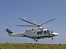 An Atlantic Airways helicopter landing at Tórshavn helipad on its way to Klaksvik, Svínoy, and Kirkja