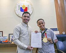 Senator Manny Pacquiao with Didal and her Asian Games medal. Pacquiao and Didal.jpg