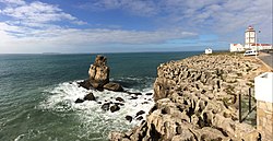 The cape's lighthouse to the right, Nau dos Corvos, (Carrack of Crows), to the left and the Berlengas in the far background.